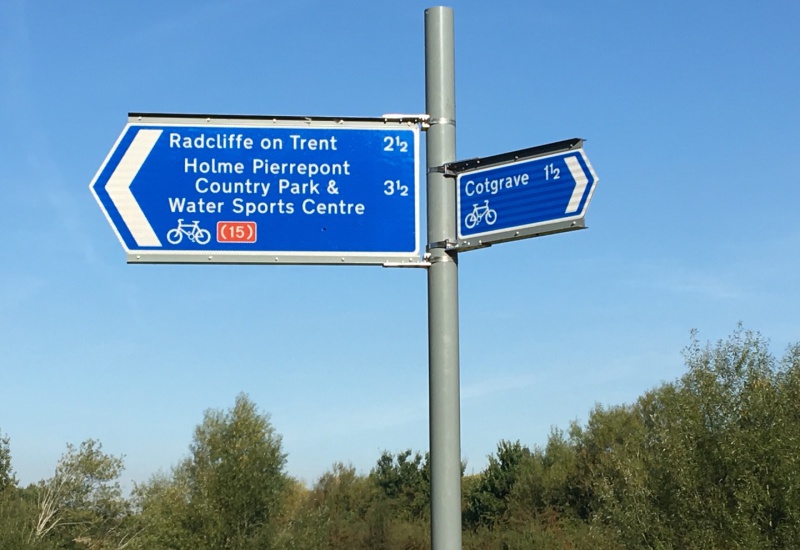 A signpost in the park, showing some of the cycling routes