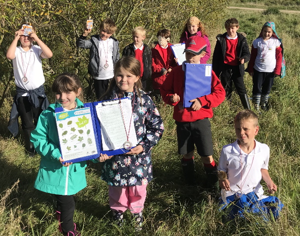 A photo depicticting the children and parents nature walk 